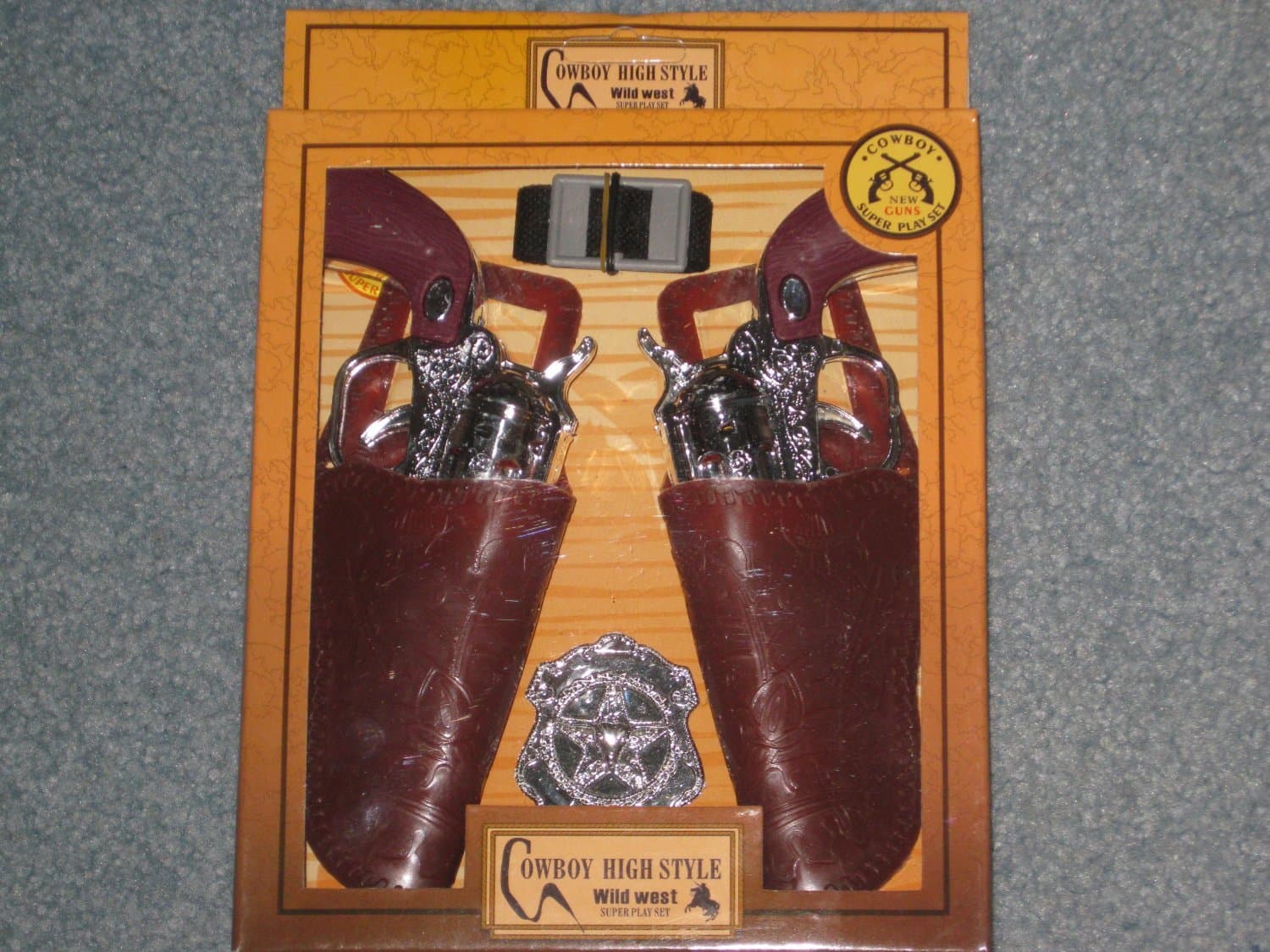 COWBOY DOUBLE GUN AND HOLSTER SET BROWN OR BLACK SENT AT RANDOM - FOR KIDS ONLY- NOT SUITABLE FOR ADULTS- APPROX 6 1/2" IN SIZE (PLEASE SEE PHOTOS 1 AND 2 FOR 2 DESIGNS BEING SHIPPED AT RANDOM)