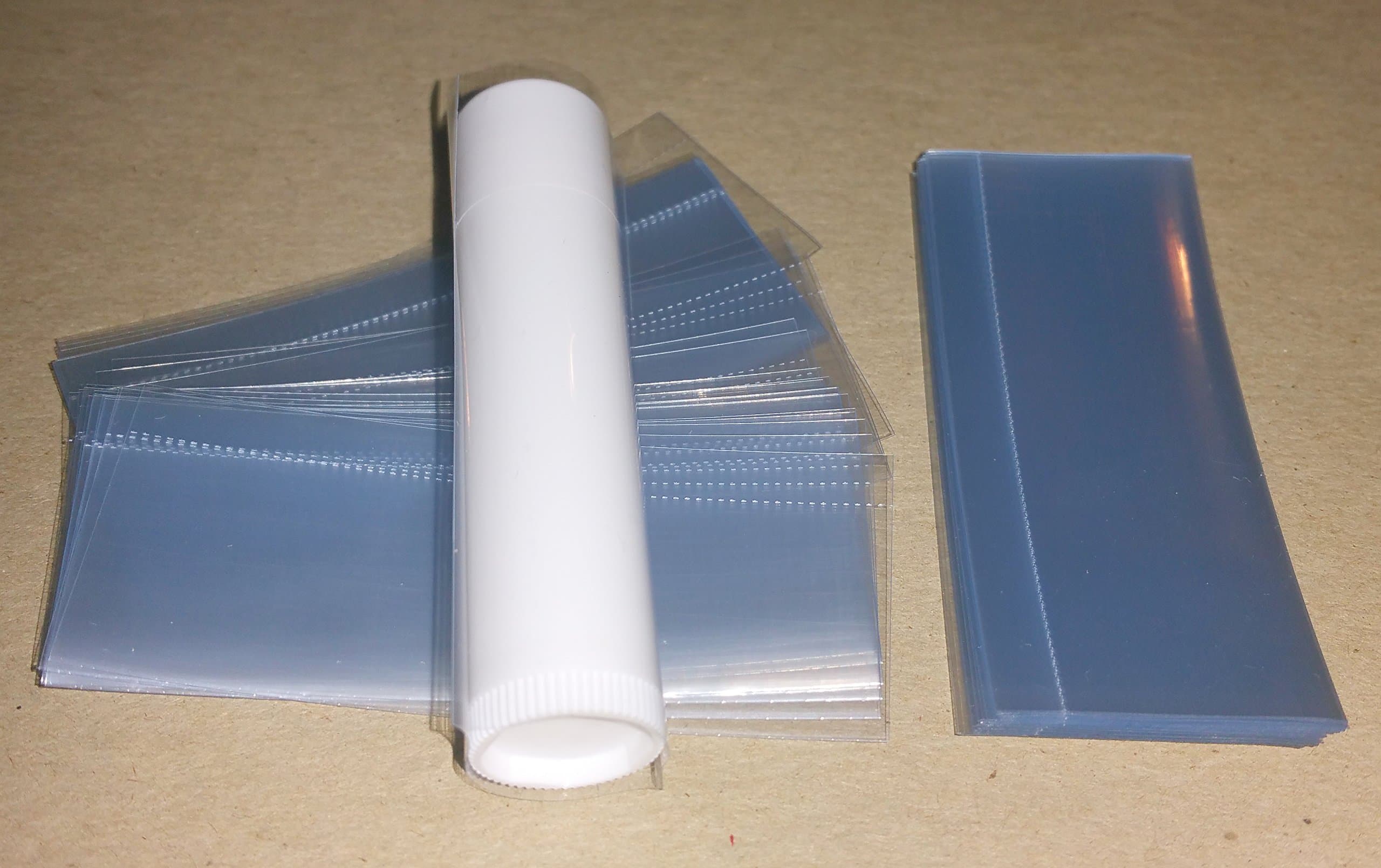 100 Clear Shrink Wrap Bands Sleeves for Lip Balm (Chapstick) Tubes - Vertical Perforation